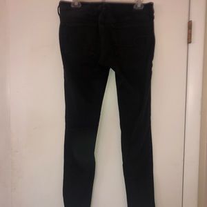 Black skinny jeans with knee rips